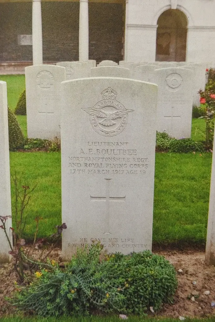 a couple of headstones in front of a building